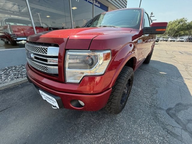 2013 Ford F-150 Limited in Maroon — front three-quarter view